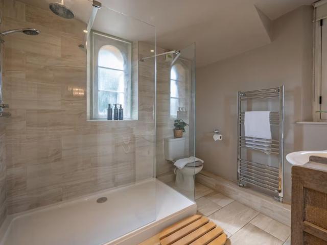 Bath | 24 Sleeper House with Hot Tubs image