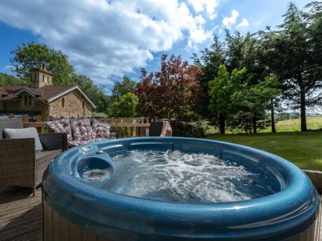 Bath | 24 Sleeper House with Hot Tubs image
